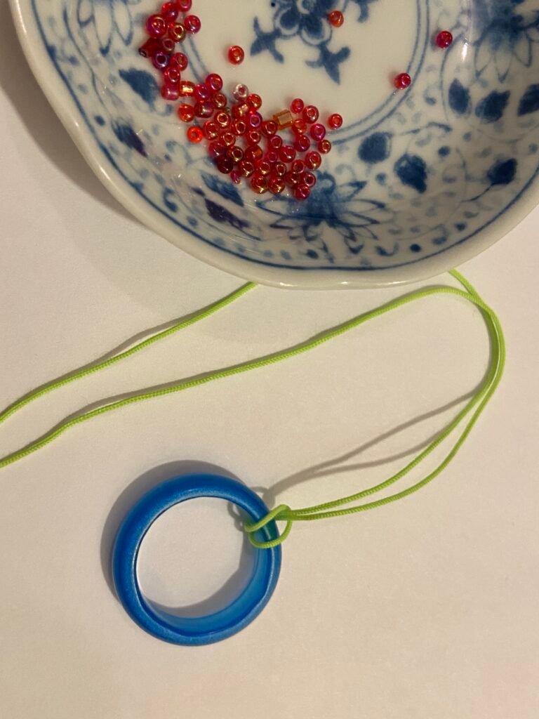 Circle Bracelet — Blue Ring on Green Cord